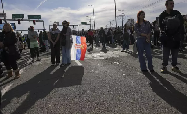 People take part in a student-led 24 hour block on an intersection to protest the deaths of 15 people killed in the November collapse of a train station canopy, in Belgrade, Serbia, Monday, Jan. 27, 2025. (AP Photo/Darko Vojinovic)
