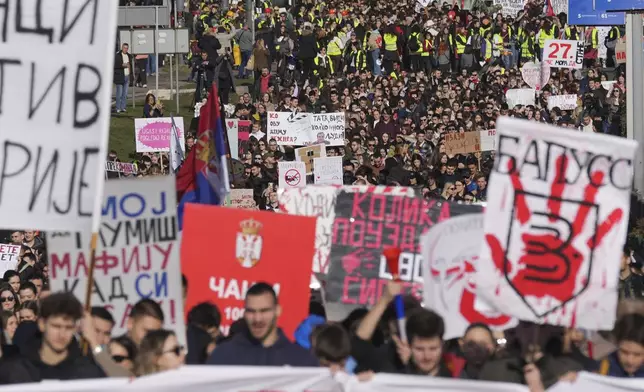 Students march during a student-led 24 hour block on an intersection to protest the deaths of 15 people killed in the November collapse of a train station canopy, in Belgrade, Serbia, Monday, Jan. 27, 2025. (AP Photo/Darko Vojinovic)