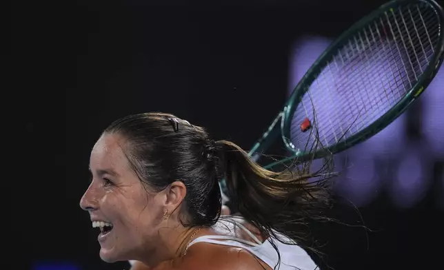 Jodie Burrage of Britain plays a backhand return to Coco Gauff of the U.S. during their second round match at the Australian Open tennis championship in Melbourne, Australia, Wednesday, Jan. 15, 2025. (AP Photo/Vincent Thian)