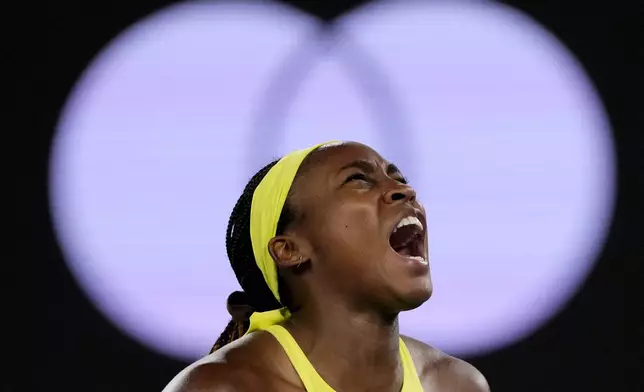 Coco Gauff of the U.S. reacts after winning a point against Jodie Burrage of Britain during their second round match at the Australian Open tennis championship in Melbourne, Australia, Wednesday, Jan. 15, 2025. (AP Photo/Vincent Thian)