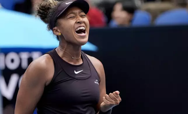 Naomi Osaka of Japan reacts after winning a point against Karolina Muchova of the Czech Republic during their second round match at the Australian Open tennis championship in Melbourne, Australia, Wednesday, Jan. 15, 2025. (AP Photo/Asanka Brendon Ratnayake)