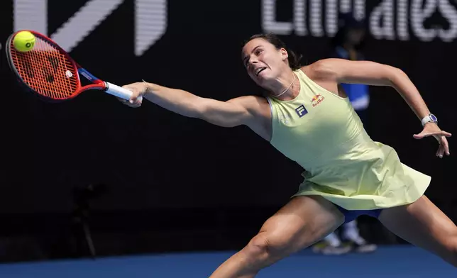 Emma Navarro of the U.S. plays a forehand return to Wang Xiyu of China during their second round match at the Australian Open tennis championship in Melbourne, Australia, Thursday, Jan. 16, 2025. (AP Photo/Ng Han Guan)