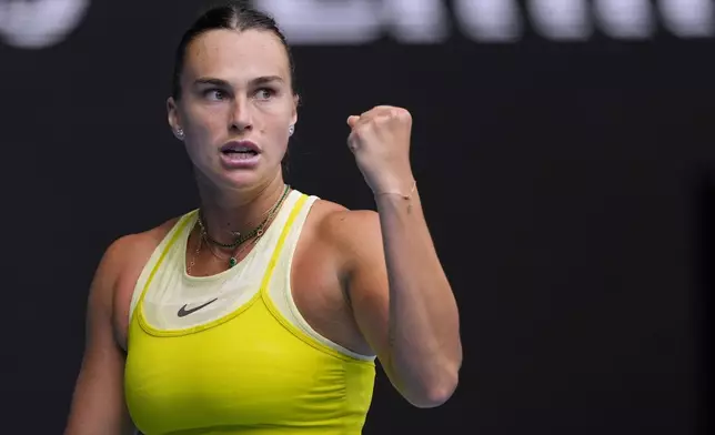 Aryna Sabalenka of Belarus reacts after winning a point against Jessica Bouzas Maneiro of Spain during their second round match at the Australian Open tennis championship in Melbourne, Australia, Wednesday, Jan. 15, 2025. (AP Photo/Vincent Thian)