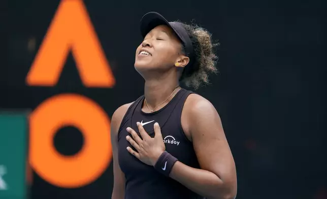 Naomi Osaka of Japan reacts after defeating Karolina Muchova of the Czech Republic in their second round match at the Australian Open tennis championship in Melbourne, Australia, Wednesday, Jan. 15, 2025. (AP Photo/Asanka Brendon Ratnayake)