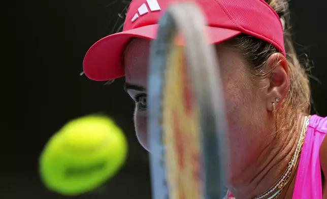 Iva Jovic of the U.S. plays a backhand return to Elena Rybakina of Kazakhstan during their second round match at the Australian Open tennis championship in Melbourne, Australia, Thursday, Jan. 16, 2025. (AP Photo/Vincent Thian)