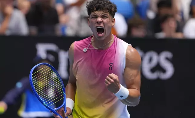 Ben Shelton of the U.S. reacts after winning a point against Pablo Carreno Busta of Spain during their second round match at the Australian Open tennis championship in Melbourne, Australia, Thursday, Jan. 16, 2025. (AP Photo/Vincent Thian)