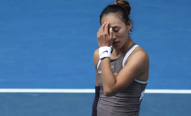 Zheng Qinwen of China reacts during her second round match against Laura Siegemund of Germany at the Australian Open tennis championship in Melbourne, Australia, Wednesday, Jan. 15, 2025. (AP Photo/Asanka Brendon Ratnayake)