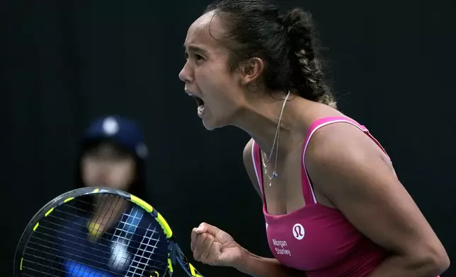 Leylah Fernandez of Canada celebrates after defeating Cristina Bucsa of Spain in their second round match at the Australian Open tennis championship in Melbourne, Australia, Wednesday, Jan. 15, 2025. (AP Photo/Manish Swarup)