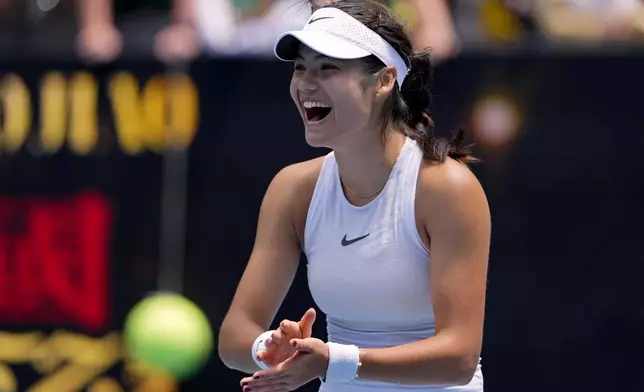 Emma Raducanu of Britain celebrates after defeating Amanda Anisimova of the U.S. in their second round match at the Australian Open tennis championship in Melbourne, Australia, Thursday, Jan. 16, 2025. (AP Photo/Vincent Thian)