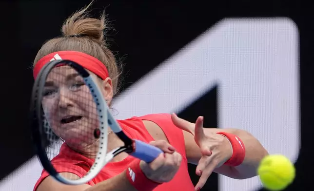 Karolina Muchova of the Czech Republic plays a forehand return to Naomi Osaka of Japan during their second round match at the Australian Open tennis championship in Melbourne, Australia, Wednesday, Jan. 15, 2025. (AP Photo/Asanka Brendon Ratnayake)