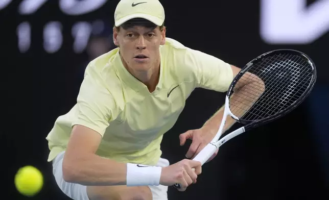 Jannik Sinner of Italy plays a backhand return to Tristan Schoolkate of Australia during their second round match at the Australian Open tennis championship in Melbourne, Australia, Thursday, Jan. 16, 2025. (AP Photo/Asanka Brendon Ratnayake)
