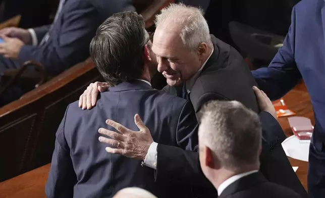 House Majority Leader Steve Scalise, R-La., right, congratulates House Speaker Mike Johnson, R-La., upon Johnson's re-election as the House of Representatives meets to elect a speaker and convene the new 119th Congress at the Capitol in Washington, Friday, Jan. 3, 2025. (AP Photo/Jacquelyn Martin)