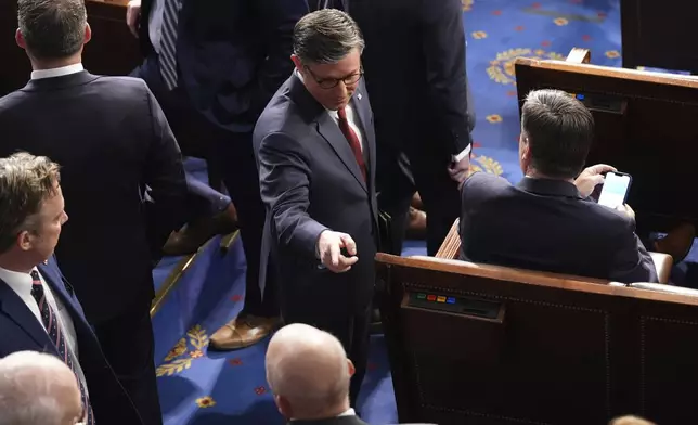 House Speaker Mike Johnson, R-La., greets members as the House of Representatives meets to elect a speaker and convene the new 119th Congress at the Capitol in Washington, Friday, Jan. 3, 2025. (AP Photo/Jacquelyn Martin)