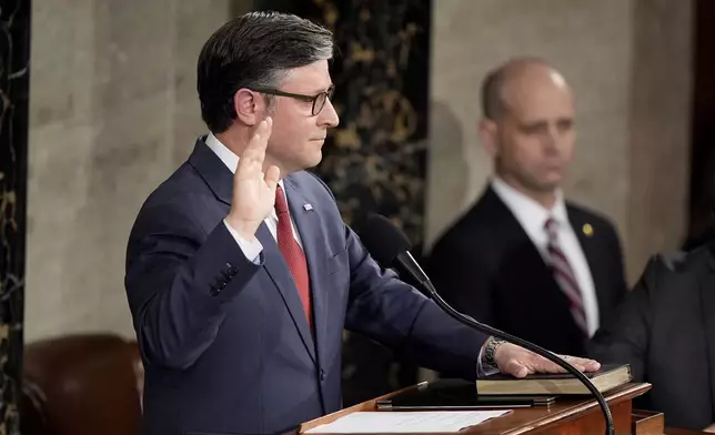 House Speaker Mike Johnson, R-La., takes the oath of office after being re-elected as the House of Representatives meets to elect a speaker and convene the new 119th Congress at the Capitol in Washington, Friday, Jan. 3, 2025.(AP Photo/Mark Schiefelbein)