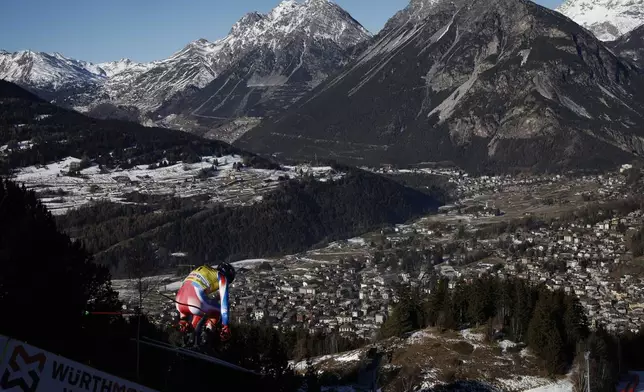 France's Cyprien Sarrazin is airborn during an alpine ski, men's World Cup downhill training, in Bormio, Italy, Friday, Dec. 27, 2024. (AP Photo/Gabriele Facciotti)