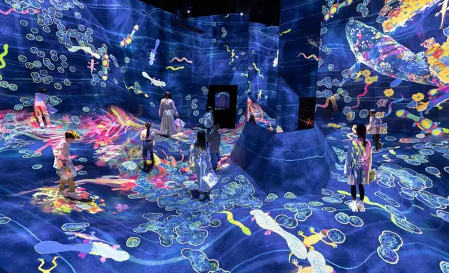 teamLab, Graffiti Nature, Sketch Waterfall Droplets, Beating Earth (c) teamLab - All the various creatures drawn by everyone live in the inverted globe. Color in a creature on the paper provided, and see the picture you have drawn come to life and move in front of you.