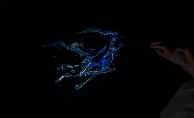 teamLab, Reversible Rotation in the Black Emptiness (c) teamLab - In Black Emptiness, because it is empty, infinite possibilities open up where anything can enter it. When you sit down, Spatial Calligraphy is drawn in front of you. The Spatial Calligraphy in this artwork space rotates in the same direction, but because of the characteristics of Ultrasubjective Space, visually, the clockwise and counterclockwise rotation are equivalent. Hence, the work can appear to be rotating in either direction depending on how the viewer chooses to see it.