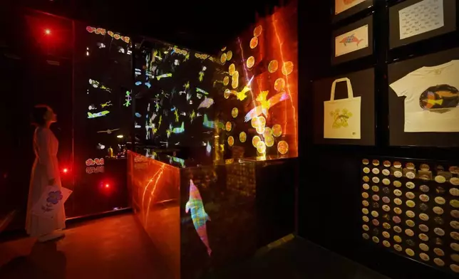 teamLab, Sketch Factory, Cognitive Solidified Sparks (c) teamLab - This is a factory where the creatures that you draw can be made into an original item (tin badge, hand towel, T-shirt, tote bag or paper craft) and taken home.