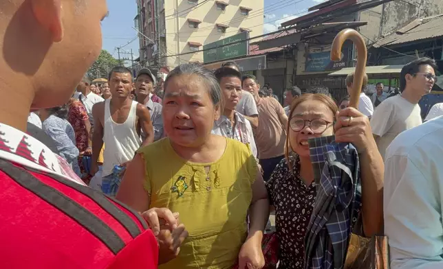 Released prisoners are welcomed by family members and colleagues outside Insein Prison Saturday, Jan. 4 , 2025, in Yangon, Myanmar, as the military government has released more than 6,000 prisoners and has reduced other inmates’ sentences as part of a mass amnesty to mark the 77th anniversary of independence from Britain. (AP Photo/Thein Zaw)