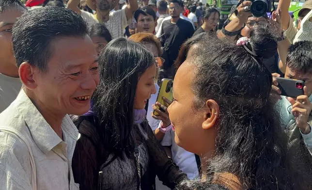 Released prisoners are welcomed by family members and colleagues outside Insein Prison Saturday, Jan. 4, 2025, in Yangon, Myanmar. (AP Photo/Thein Zaw)