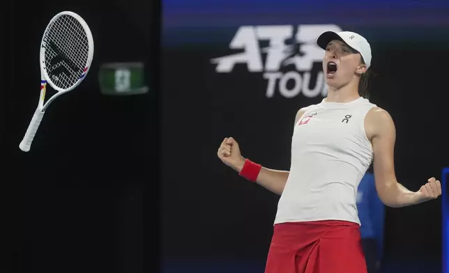 Poland's Iga Swiatek celebrates after defeating Britain's Katie Boulter in their quaterfinal match at the United Cup tennis tournament in Sydney, Australia, Thursday, Jan. 2, 2025. (AP Photo/Mark Baker)