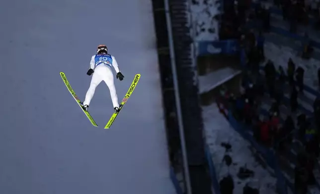 Jan Hoerl, of Austria, soars through the air during training at the third stage of the 73rd Four Hills ski jumping tournament in Innsbruck, Austria, Friday, Jan. 3, 2025. (AP Photo/Matthias Schrader)