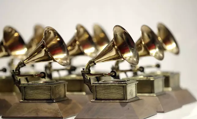 FILE - Grammy Awards are displayed at the Grammy Museum Experience at Prudential Center in Newark, N.J. on Oct. 10, 2017. (AP Photo/Julio Cortez, File)