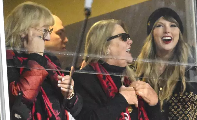 Donna Kelce, Andrea Swift and Taylor Swift, from left, watch play between the Kansas City Chiefs and the Buffalo Bills during the first half of the AFC Championship NFL football game, Sunday, Jan. 26, 2025, in Kansas City, Mo. (AP Photo/Reed Hoffmann)