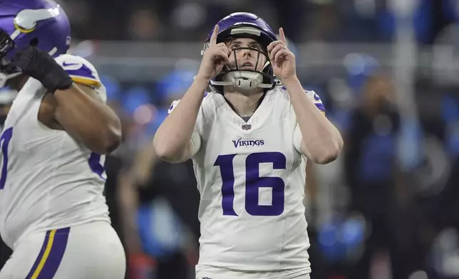 Minnesota Vikings place kicker Will Reichard (16) reacts after kicking a field goal against the Detroit Lions during the first half of an NFL football game Sunday, Jan. 5, 2025, in Detroit. (AP Photo/Charlie Riedel)