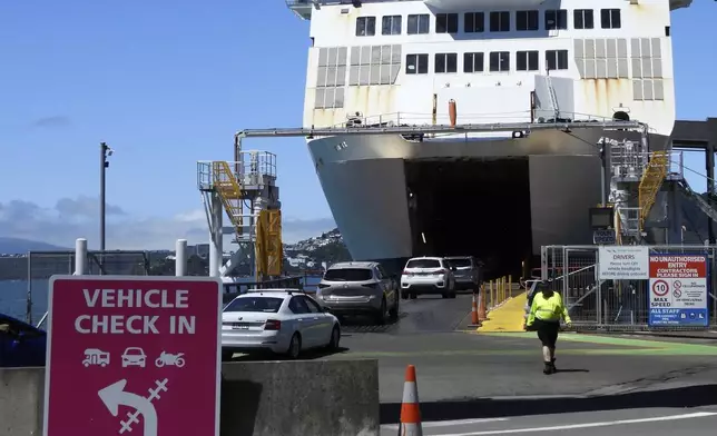 Cars board an Interislander ferry in Wellington, New Zealand, on Tuesday, Jan. 7, 2025. (AP Photo/Charlotte Graham-McLay)