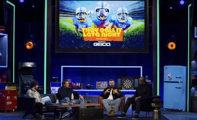 Former NFL player and ESPN analyst Jason Kelce, center right, talks with his guest: American Rapper and Comedian Lil Dicky, left, former NFL player Brian Baldinger, center left, and NBA Hall of Famer Charlies Barkley, right, during the taping of "They Call It Late Night with Jason Kelce", Friday, Jan. 3, 2025, in Philadelphia. (AP Photo/Chris Szagola)