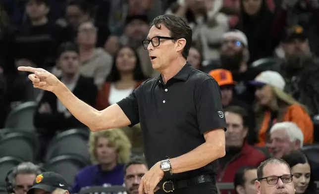 Atlanta Hawks head coach Quin Snyder gives instructions to his players during the first half of an NBA basketball game against the Phoenix Suns Thursday, Jan. 9, 2025, in Phoenix. (AP Photo/Ross D. Franklin)