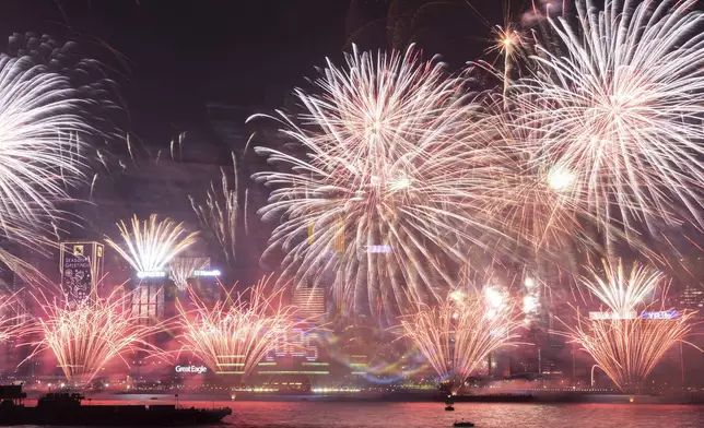 Fireworks explode over Victoria Harbour to celebrate the start of 2025 at Tsim Sha Tsui in Hong Kong, Wednesday, Jan. 1, 2025. (AP Photo/Chan Long Hei)