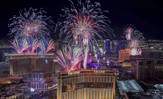 Fireworks explode over the Las Vegas Strip during a New Year's Eve celebration Wednesday, Jan. 1, 2025, in Las Vegas. (AP Photo/David Becker)