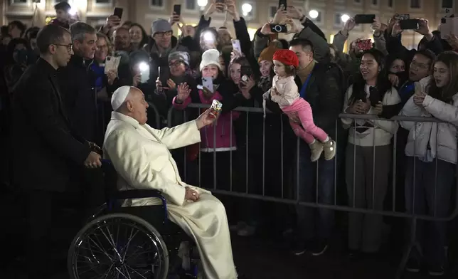 Pope Francis waves faithfuls after celebrating over New Year's Eve Vespers and Te Deum, in St.Peter's Square at the Vatican, Tuesday, Dec. 31, 2024. (AP Photo/Andrew Medichini)