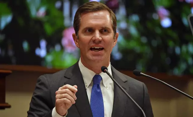 Kentucky Governor Andy Beshear gives his State of The Commonwealth address in the House chamber at the Kentucky State Capitol in Frankfort, Ky., Wednesday, Jan. 8, 2025. (AP Photo/Timothy D. Easley)