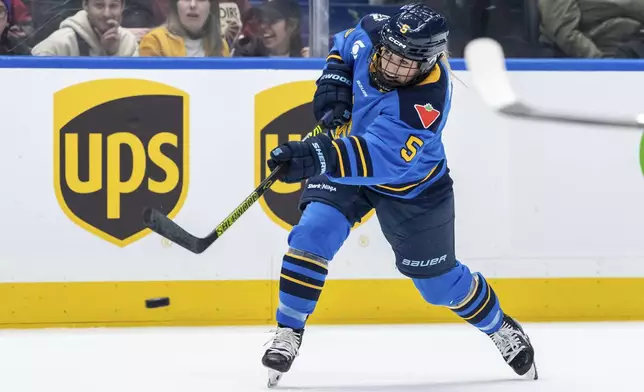 Toronto Sceptres' Savannah Harmon (5) shoots the puck against the Montreal Victoire during the second period of PWHL hockey game in Vancouver, on Wednesday, Jan. 8, 2025. (Ethan Cairns/The Canadian Press via AP)