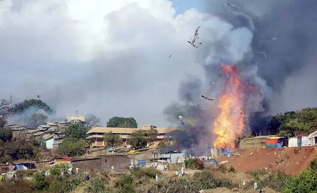 FILE - Fire breaks out a temple in Wai village, about 250 kilometers (150 miles) south of Bombay, India, on Jan. 25, 2005. (AP Photo/Rahul Deshpande, File)