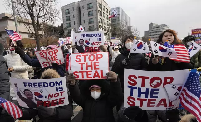 Supporters of impeached South Korean President Yoon Suk Yeol attend a rally to oppose his impeachment near the presidential residence in Seoul, South Korea, Wednesday, Jan. 8, 2025. (AP Photo/Ahn Young-joon)