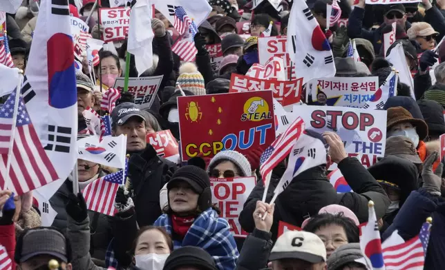 Supporters of impeached South Korean President Yoon Suk Yeol attend a rally to oppose his impeachment near the presidential residence in Seoul, South Korea, Wednesday, Jan. 8, 2025. (AP Photo/Ahn Young-joon)