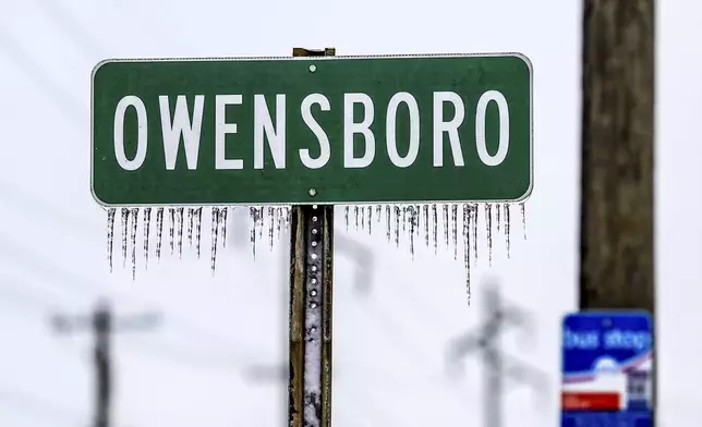 Icicles hang from a sign entering the city of Owensboro, Ky, Wednesday, Jan. 8, 2025, as rigidly cold weather sets in after winter storm Blair. (Greg Eans/The Messenger-Inquirer via AP)