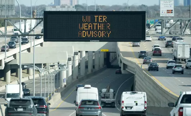 A sign warns drivers of a winter storm expected to hit the North Texas region tomorrow in Dallas, Wednesday, Jan. 8, 2025. (AP Photo/LM Otero)