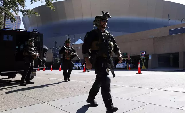 Local SWAT teams patrol outside the Caesars Superdome ahead of the Sugar Bowl NCAA College Football Playoff game, Thursday, Jan. 2, 2025, in New Orleans. (AP Photo/Butch Dill)