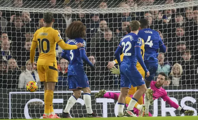 Chelsea's Tosin Adarabioyo, second right, scores the opening goal during the English Premier League soccer match between Chelsea and Wolverhampton at Stamford Bridge stadium in London, Monday, Jan. 20, 2025. (AP Photo/Kin Cheung)