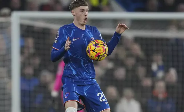 Chelsea's Cole Palmer controls the ball during the English Premier League soccer match between Chelsea and Wolverhampton at Stamford Bridge stadium in London, Monday, Jan. 20, 2025. (AP Photo/Kin Cheung)