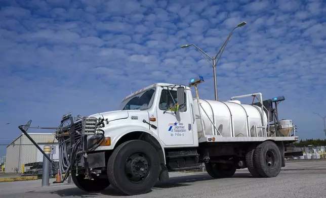 A brine truck leaves the Texas Department of Transportation Dallas Southwest lot as crews prepare the roads ahead of a winter storm expected to hit the North Texas region, Tuesday, Jan. 7, 2025, in Cedar Hill, Texas. (AP Photo/Julio Cortez)