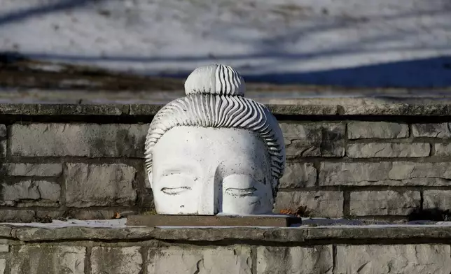 A sculpture is seen in the Arrington Lagoon Fountain during cold weather in Evanston, Ill., Wednesday, Jan. 8, 2025. (AP Photo/Nam Y. Huh)