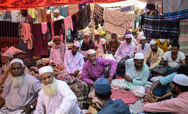 Muslim devotees rest in a makeshift tent during the first phase of the three-day Biswa Ijtema, or the World Congregation of Muslims, at the banks of the Turag river in Tongi, near Dhaka, Bangladesh, Friday, Jan. 31, 2025. (AP Photo/Mahmud Hossain Opu)