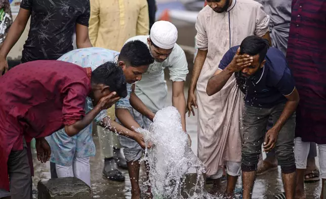 Muslim devotees perform ablutions before prayers during the first phase of the three-day Biswa Ijtema, or the World Congregation of Muslims, at the banks of the Turag river in Tongi, near Dhaka, Bangladesh, Friday, Jan. 31, 2025. (AP Photo/Mahmud Hossain Opu)
