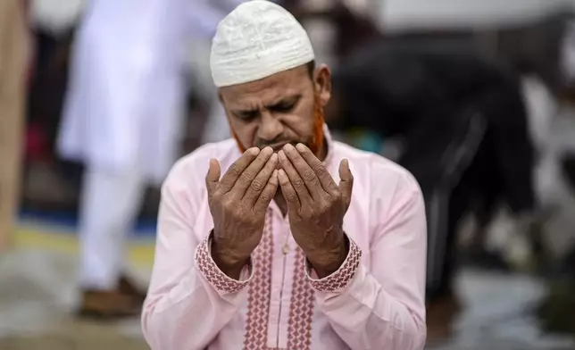 A Muslim devotee prays during the first phase of the three-day Biswa Ijtema, or the World Congregation of Muslims, at the banks of the Turag river in Tongi, near Dhaka, Bangladesh, Friday, Jan. 31, 2025. (AP Photo/Mahmud Hossain Opu)